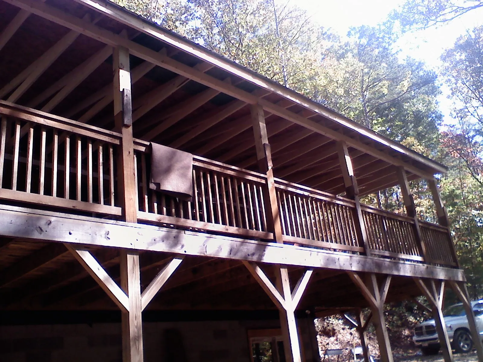 Timber framing under a new elevated porch and deck — Roof Leak Repair in Yelm by Roofing Brothers